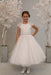Stunning first holy communion dress has lace cap sleeves and bodice with rhinestone waist detail